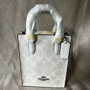 Coach North South Mini tote in signature canvas.